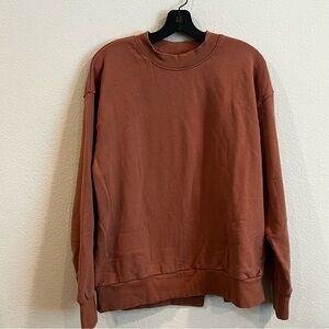 Mouggan Plain Me rusty orange size small crewneck sweatshirt with back side slit